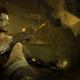 Deus Ex's Adam Jensen sits back and takes a long drag.
